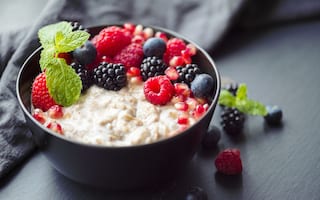 Healthy organic porridge topped with berries